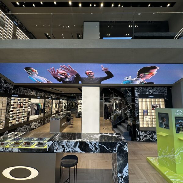 Sales floor with suspended LED ceiling and marble-framed displays, Oakley Covent Garden