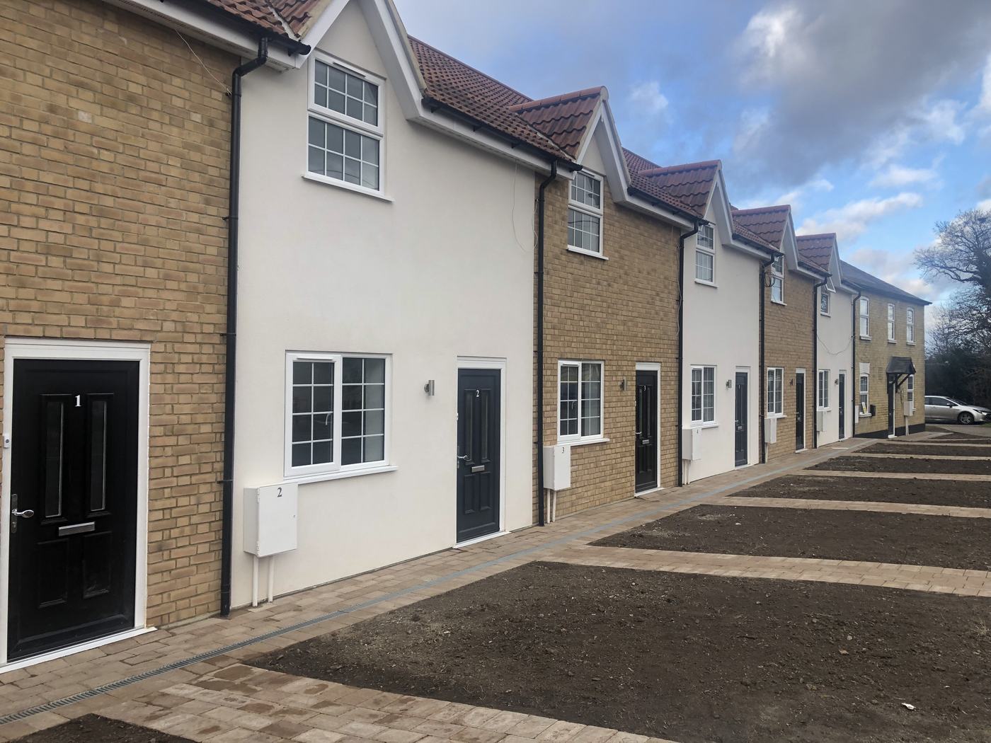 new-build-terraced-houses-front-01: Terrace of six new-build houses in Purley, a project by Raffaello Fair
